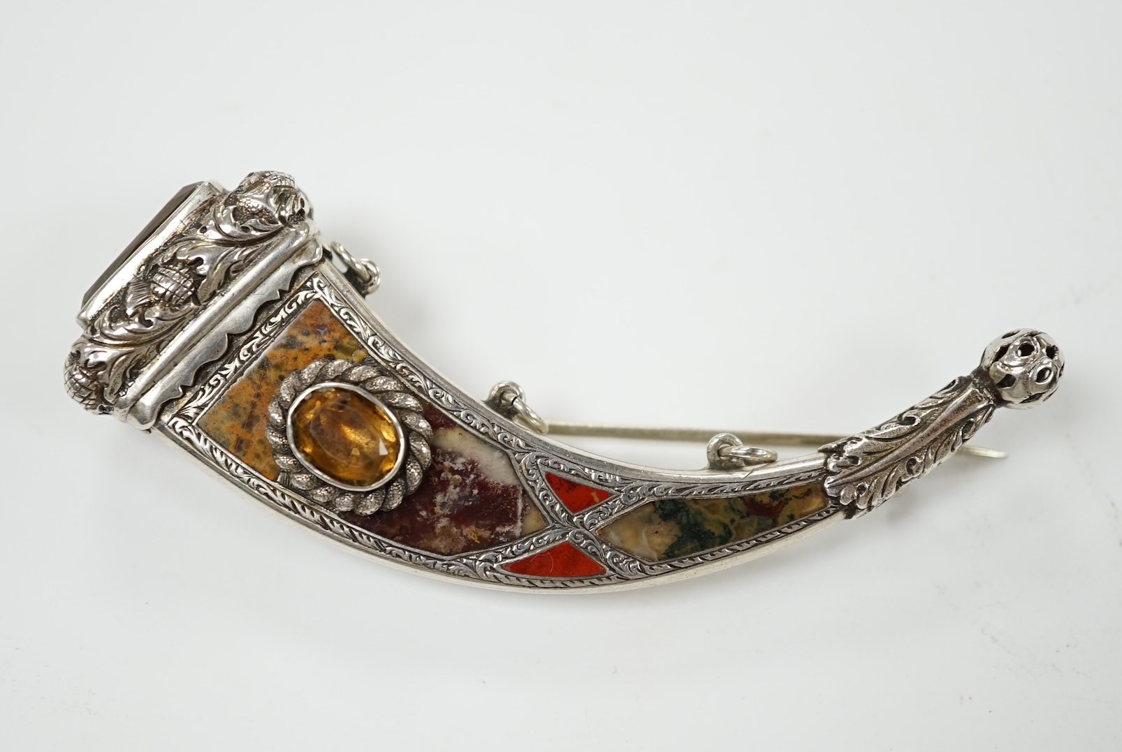 A Victorian white metal, citrine and Scottish hardstone set brooch, 85mm. Condition - fair